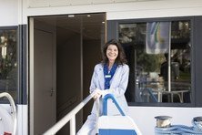 Portrait of an employee standing at the railing