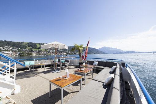 Outdoor lounges at the rear Outdoor deck with tables and lounge and view over Lake Zug