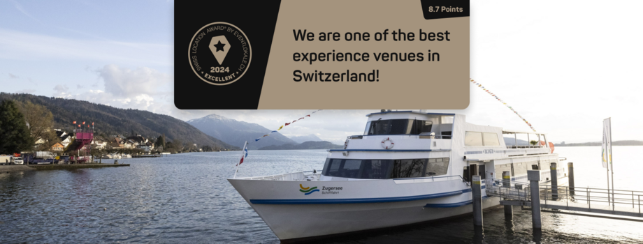 Header image in English from Erlebnislocation Award with ship at the jetty